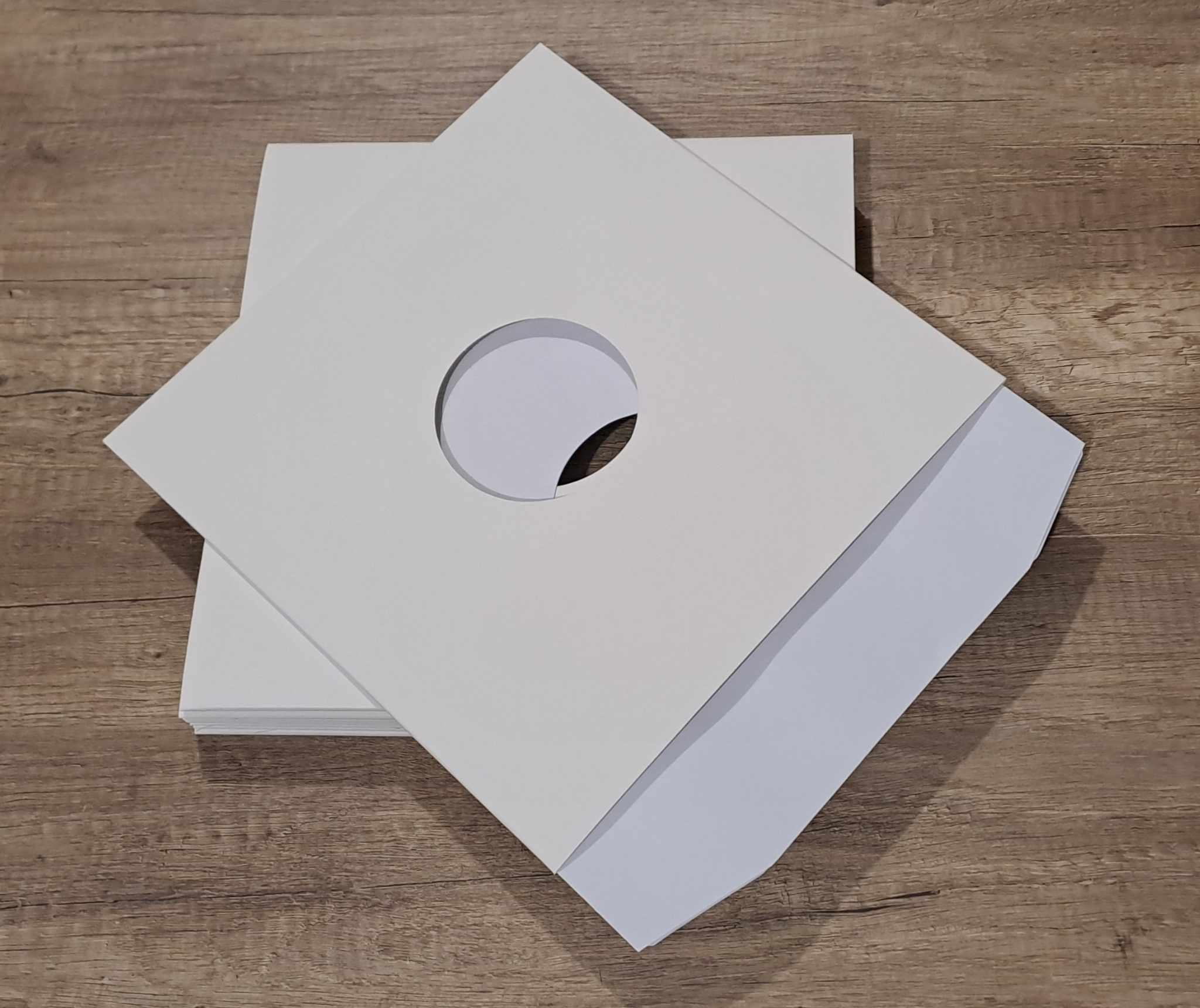 25 Pochettes carton avec trou 33T blanches surface mate